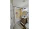 Charming bathroom with rustic vanity, patterned shower curtain and round mirror at 1000 Bozeman Dr, Atlanta, GA 30341