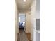 Hallway leading to a bedroom with hardwood floors and neutral paint at 1000 Bozeman Dr, Atlanta, GA 30341