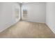 Neutral-toned bedroom featuring soft carpeting and natural light from two windows at 123 Laurel Springs Dr, Mcdonough, GA 30253