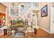 Bright foyer with hardwood floors, stairs to the second floor, and decorative furnishings at 2040 Winding Circle Trl, Fairburn, GA 30213