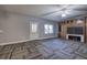 Basement featuring gray walls, patterned carpet, and a built-in wooden entertainment center at 3759 Maryhill Nw Ln, Kennesaw, GA 30152