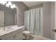 Bathroom with a white vanity, shower curtain, and neutral walls at 3759 Maryhill Nw Ln, Kennesaw, GA 30152