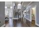 Bright foyer with hardwood floors, a staircase, and views into other living spaces at 3759 Maryhill Nw Ln, Kennesaw, GA 30152