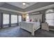 Spacious bedroom featuring many windows, trey ceiling, and carpet floors at 3759 Maryhill Nw Ln, Kennesaw, GA 30152