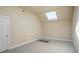 Spacious attic room filled with natural light from a skylight window at 409 Angier Ne Ct, Atlanta, GA 30312