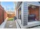 Cozy backyard featuring a hot tub, wood deck, small grass area and stone walkway at 409 Angier Ne Ct, Atlanta, GA 30312