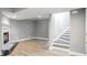 Open basement with a fireplace and staircase, perfect for entertaining at 409 Angier Ne Ct, Atlanta, GA 30312