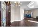 Inviting entryway featuring hardwood floors, a chandelier, and views to the dining room at 409 Angier Ne Ct, Atlanta, GA 30312