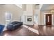 Spacious living room featuring hardwood floors, fireplace, and large windows for natural light at 409 Angier Ne Ct, Atlanta, GA 30312