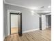 Finished living room with light wood flooring, gray walls, and a secure vault entrance at 409 Angier Ne Ct, Atlanta, GA 30312