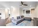 Bright and airy living room showcasing a gray sofa, fireplace, and hardwood floors at 409 Angier Ne Ct, Atlanta, GA 30312