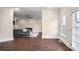 Open living room showcasing hardwood floors, a ceiling fan, and neutral color palette at 409 Angier Ne Ct, Atlanta, GA 30312