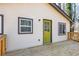 Exterior of home featuring an entryway door with a large window and wood plank siding at 526 Myrtle St, Villa Rica, GA 30180