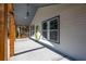 Covered front porch with wooden beams, concrete flooring, and exterior view of the home's entrance at 526 Myrtle St, Villa Rica, GA 30180