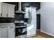 Kitchen featuring stainless steel appliances, quartz countertops, and white cabinets at 526 Myrtle St, Villa Rica, GA 30180