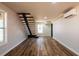 Spacious living room featuring hardwood floors and an elegant floating staircase at 526 Myrtle St, Villa Rica, GA 30180