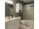 Compact bathroom with white cabinets, shower over tub, and tile floor at 2431 Weatherstone Se Cir, Conyers, GA 30094