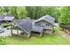 This aerial shot showcases a home with a two-car carport, a screened-in porch, and a fenced-in yard, great for outdoor enjoyment at 2657 Langland Ne Ct, Atlanta, GA 30345