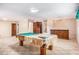 Finished basement featuring a full-size billiard table and wet bar for entertaining at 2657 Langland Ne Ct, Atlanta, GA 30345