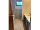 Updated bathroom with tiled walls, a granite vanity, and natural lighting at 2657 Langland Ne Ct, Atlanta, GA 30345