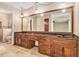 Bathroom featuring a large vanity with double sinks and a decorative mirror at 2657 Langland Ne Ct, Atlanta, GA 30345