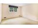 Bedroom with a window, neutral walls, and carpeted flooring at 2657 Langland Ne Ct, Atlanta, GA 30345