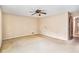 Bedroom with neutral walls, ceiling fan, and a closet door on the right at 2657 Langland Ne Ct, Atlanta, GA 30345