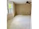 Bedroom with windows and plush carpet, offering a cozy retreat at 2657 Langland Ne Ct, Atlanta, GA 30345