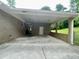Spacious carport attached to a brick home providing covered parking and protection from the elements at 2657 Langland Ne Ct, Atlanta, GA 30345