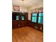 Bright dining room with wood paneled walls, chandelier, and charming window valances at 2657 Langland Ne Ct, Atlanta, GA 30345