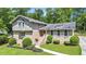 Charming home featuring a brick facade, complemented by lush landscaping and mature trees at 2657 Langland Ne Ct, Atlanta, GA 30345
