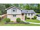 Charming home featuring a brick facade, complemented by lush landscaping and mature trees at 2657 Langland Ne Ct, Atlanta, GA 30345
