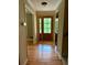 Inviting foyer with gleaming hardwood floors and a charming front door with window panes at 2657 Langland Ne Ct, Atlanta, GA 30345