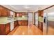 Spacious kitchen features hardwood floors, wood cabinets and modern appliances at 2657 Langland Ne Ct, Atlanta, GA 30345