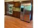 Traditional kitchen with wood cabinets, stainless steel appliances and hardwood flooring at 2657 Langland Ne Ct, Atlanta, GA 30345
