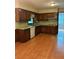 Classic kitchen featuring wood cabinets, green countertops, and stainless steel dishwasher at 2657 Langland Ne Ct, Atlanta, GA 30345