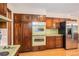 Kitchen features hardwood floors, wood cabinets and modern appliances at 2657 Langland Ne Ct, Atlanta, GA 30345
