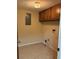 Functional laundry room with cabinets for storage and tile flooring at 2657 Langland Ne Ct, Atlanta, GA 30345