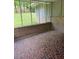 Enclosed porch with brick accent and view of the lawn at 2657 Langland Ne Ct, Atlanta, GA 30345