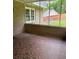 Enclosed porch with brick accent and view of the lawn at 2657 Langland Ne Ct, Atlanta, GA 30345