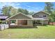 Charming home with a screened-in porch, a two-car carport, and a fenced-in yard, perfect for outdoor entertaining at 2657 Langland Ne Ct, Atlanta, GA 30345