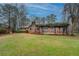 Large backyard featuring a covered patio and play area at 308 Tulipwood Sw Cir, Conyers, GA 30094