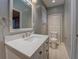 Bathroom with a white vanity, brushed nickel hardware, and a framed mirror at 308 Tulipwood Sw Cir, Conyers, GA 30094