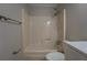 Bathroom featuring a tub with shower and neutral tile at 308 Tulipwood Sw Cir, Conyers, GA 30094