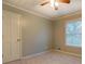 Bedroom with neutral carpet, natural lighting and a single door closet at 308 Tulipwood Sw Cir, Conyers, GA 30094