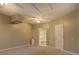 Large bedroom with neutral carpet, a ceiling fan, and a view into the bathroom at 308 Tulipwood Sw Cir, Conyers, GA 30094