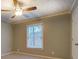 Bright bedroom with neutral paint, window, and base trim detail at 308 Tulipwood Sw Cir, Conyers, GA 30094