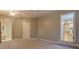 Spacious bedroom featuring neutral walls, plush carpeting, and natural light from a window at 308 Tulipwood Sw Cir, Conyers, GA 30094