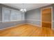 Bright dining room featuring hardwood floors, a large window, and elegant chandelier at 308 Tulipwood Sw Cir, Conyers, GA 30094