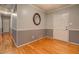 View of an empty room showcasing hardwood floors and neutral wall paint at 308 Tulipwood Sw Cir, Conyers, GA 30094